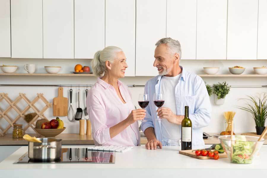 couple-drinking wine on quartz countertop